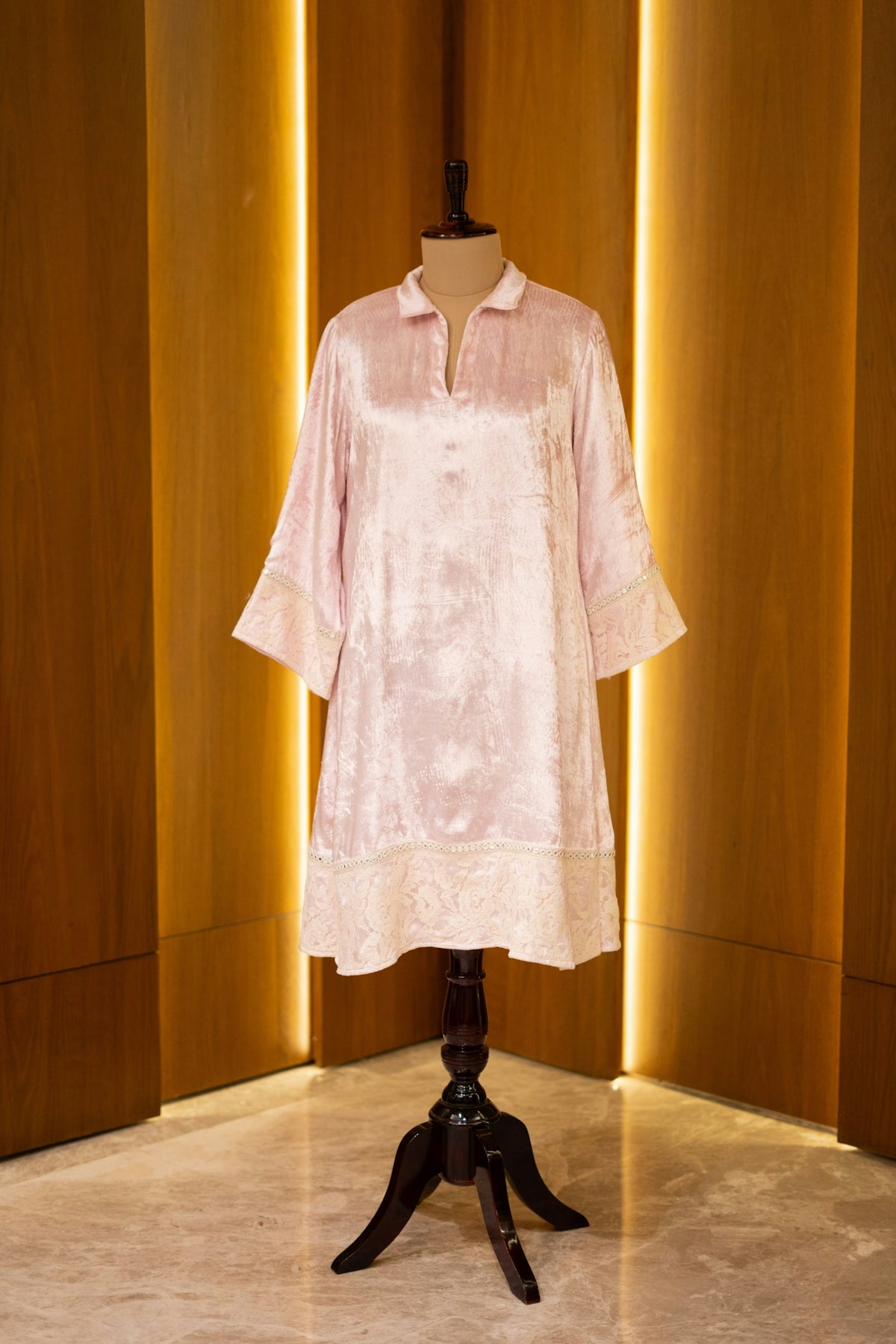 A dress on a mannequin in a room